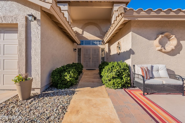 doorway to property featuring a garage