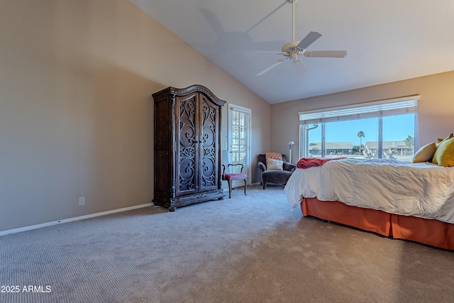 carpeted bedroom with ceiling fan and high vaulted ceiling