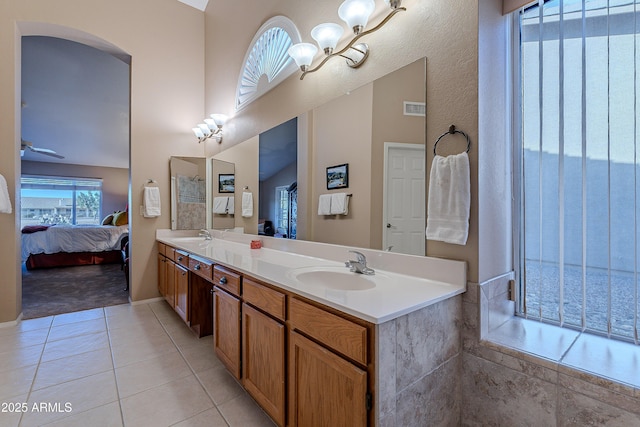 bathroom featuring ceiling fan, tile patterned floors, and vanity