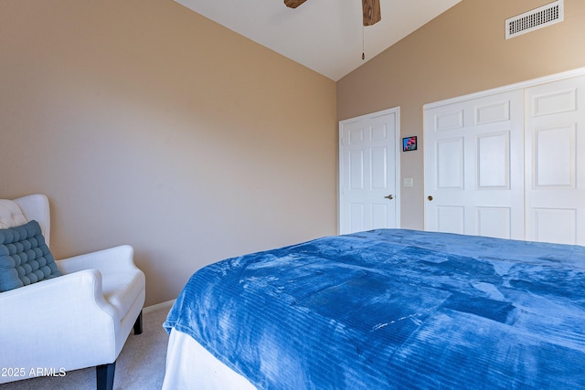 carpeted bedroom with vaulted ceiling and ceiling fan