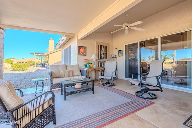 view of patio with ceiling fan and an outdoor living space