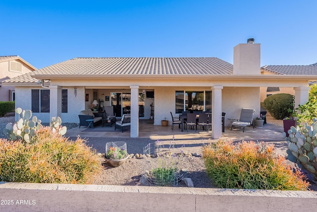 rear view of house featuring a patio