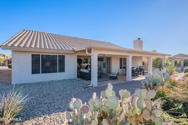 rear view of property featuring a patio