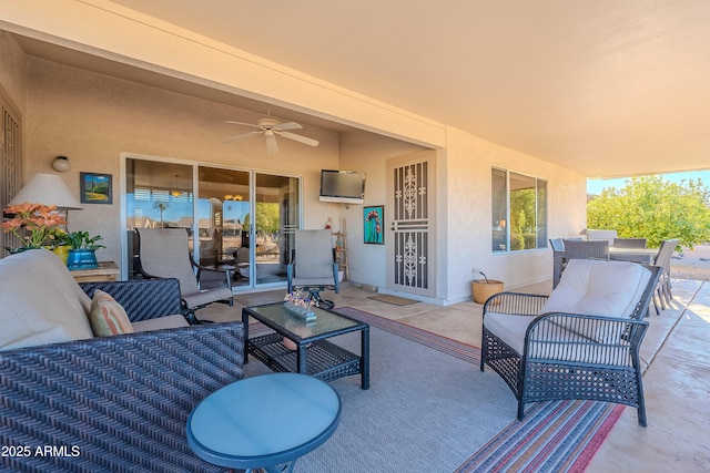 view of patio with ceiling fan and an outdoor hangout area