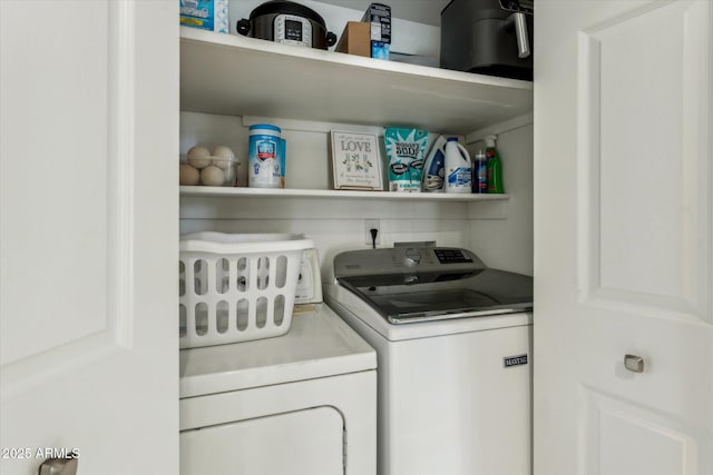 washroom with washer and dryer