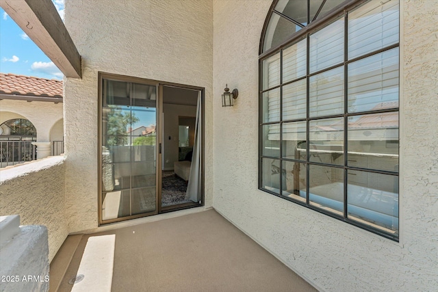 entrance to property featuring stucco siding