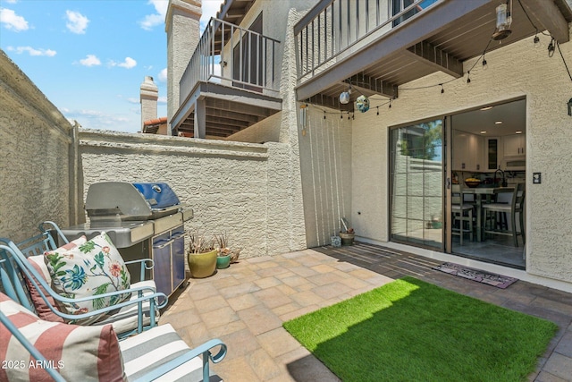 view of patio with a balcony
