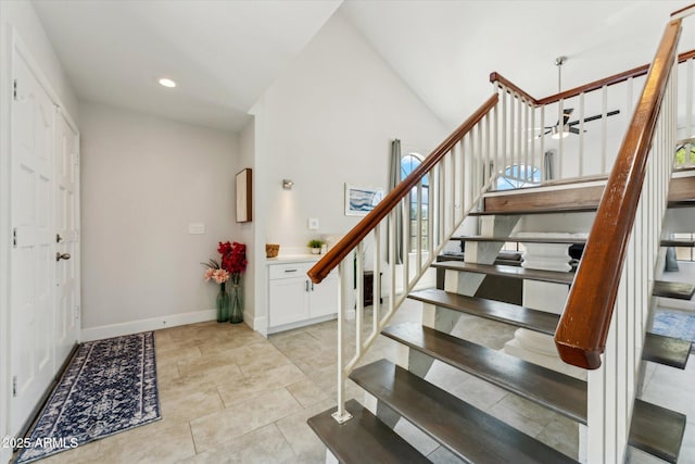 foyer with stairway, baseboards, recessed lighting, light tile patterned floors, and lofted ceiling