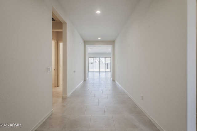 hallway featuring light tile patterned floors