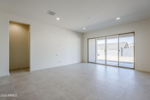 empty room with light tile patterned floors