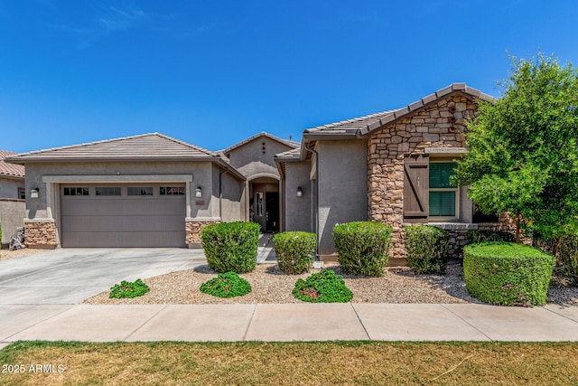 9922 E Thunderbolt Ave, Mesa, AZ 85212 - view of front of property with stucco siding, a garage, stone siding, concrete driveway, and a tile roof