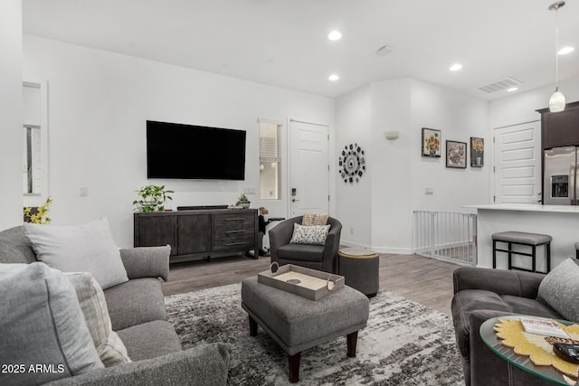 9922 E Thunderbolt Ave, Mesa, AZ 85212 - living area featuring wood finished floors, recessed lighting, and baseboards