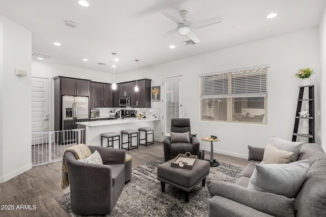 9922 E Thunderbolt Ave, Mesa, AZ 85212 - living area featuring light wood-style floors, ceiling fan, baseboards, and recessed lighting