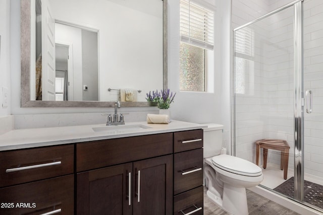 9922 E Thunderbolt Ave, Mesa, AZ 85212 - full bath with vanity, toilet, a shower stall, and wood finished floors