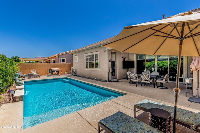9922 E Thunderbolt Ave, Mesa, AZ 85212 - view of swimming pool with a patio area, a fenced backyard, and outdoor dining space