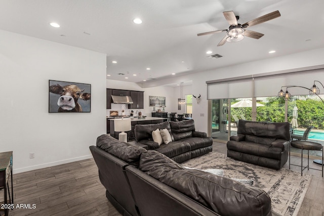 9922 E Thunderbolt Ave, Mesa, AZ 85212 - living area with dark wood finished floors, recessed lighting, a ceiling fan, and baseboards