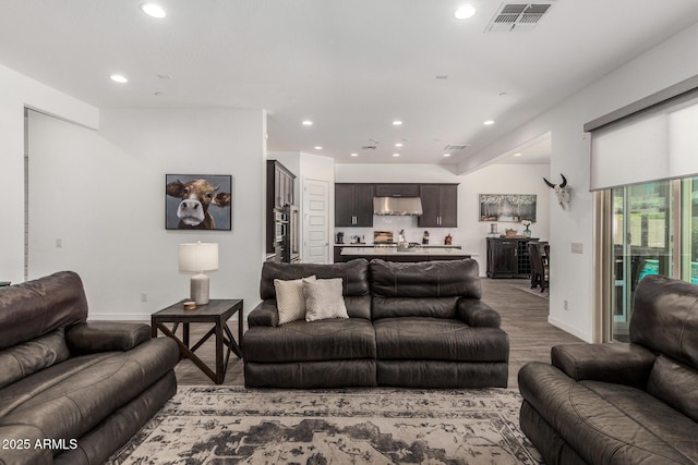 9922 E Thunderbolt Ave, Mesa, AZ 85212 - living area with recessed lighting, wood finished floors, and baseboards