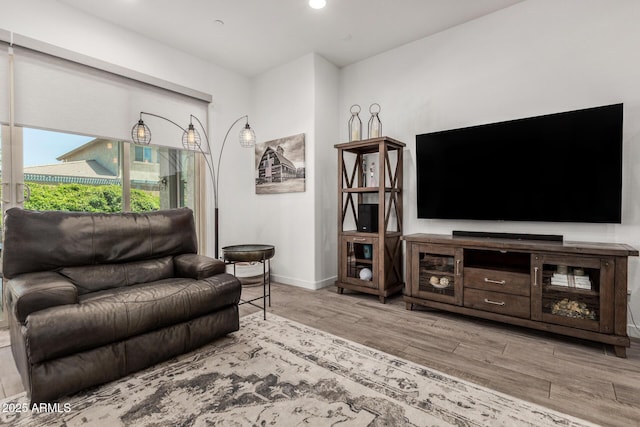 9922 E Thunderbolt Ave, Mesa, AZ 85212 - living area featuring wood finished floors, baseboards, and recessed lighting