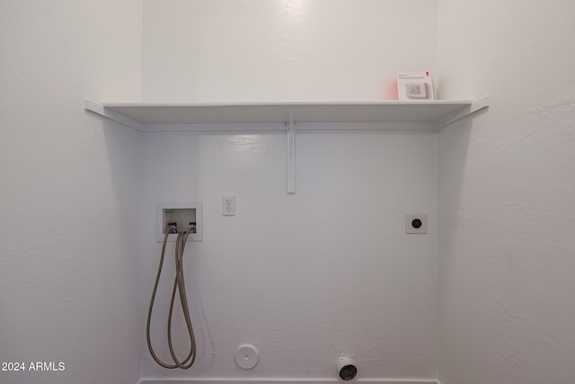 laundry room with hookup for a washing machine, electric dryer hookup, and hookup for a gas dryer