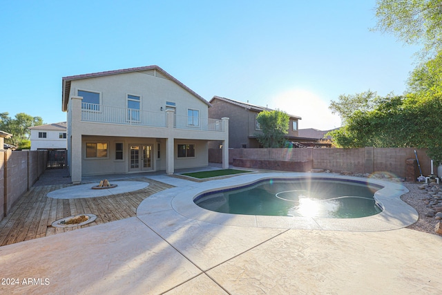 view of swimming pool featuring an outdoor fire pit and a patio area