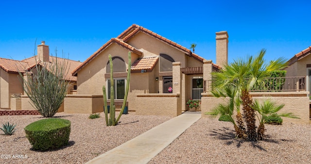 1910 E Citation Ln, Tempe, AZ 85284 - mediterranean / spanish house featuring a fenced front yard, stucco siding, a tile roof, and a gate