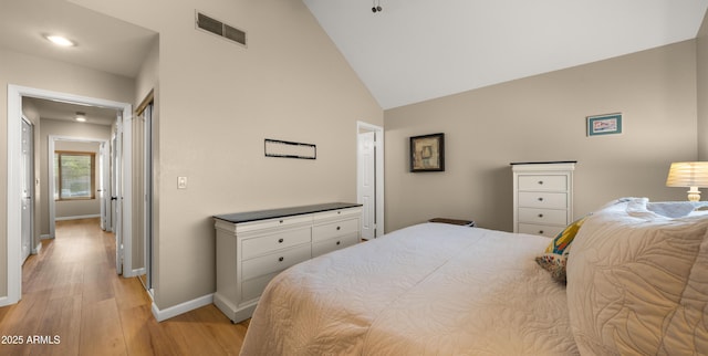 1910 E Citation Ln, Tempe, AZ 85284 - bedroom with light wood-style flooring, baseboards, and high vaulted ceiling