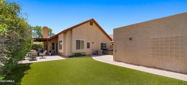 1910 E Citation Ln, Tempe, AZ 85284 - rear view of property with a patio area, stucco siding, a yard, and central air condition unit