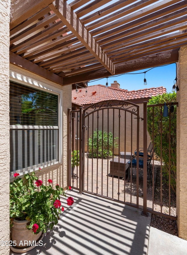 1910 E Citation Ln, Tempe, AZ 85284 - gate with a pergola and a patio area