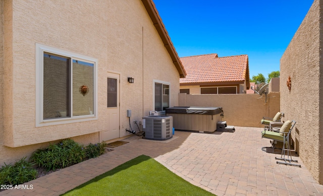 1910 E Citation Ln, Tempe, AZ 85284 - fenced backyard with a hot tub, central air condition unit, and a patio area