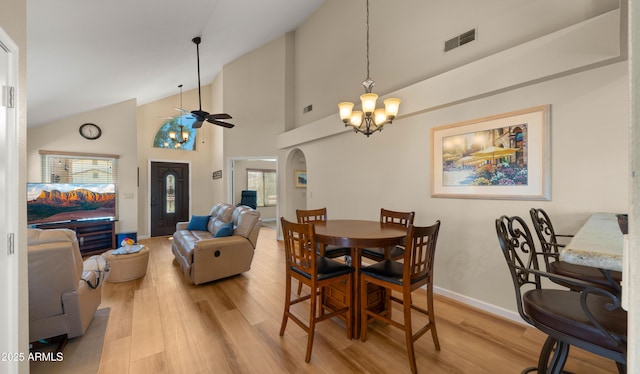 1910 E Citation Ln, Tempe, AZ 85284 - dining space featuring a chandelier, light wood-style floors, ceiling fan, baseboards, and high vaulted ceiling