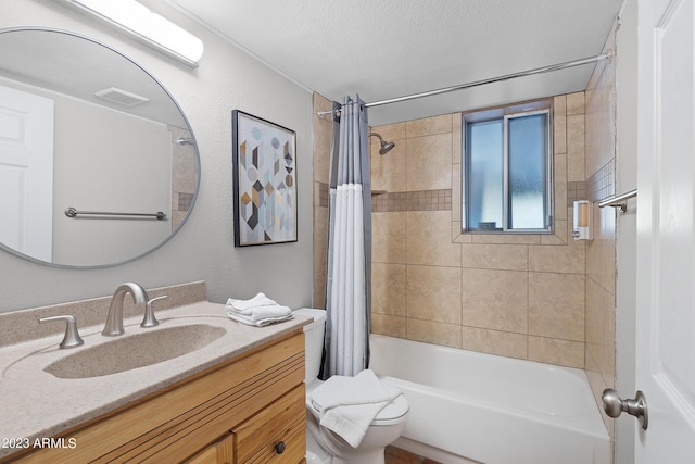 full bathroom featuring vanity, shower / bath combination with curtain, a textured ceiling, and toilet