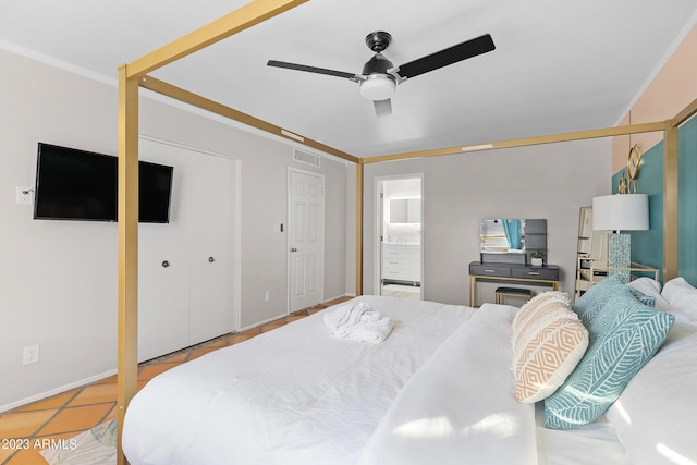 bedroom featuring ensuite bath, ceiling fan, ornamental molding, and light tile patterned flooring