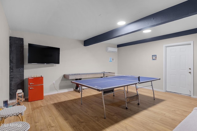 rec room with hardwood / wood-style floors and beamed ceiling