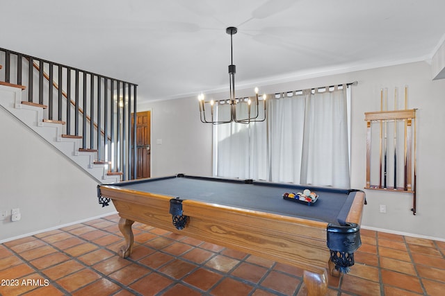 game room featuring a chandelier, dark tile patterned floors, ornamental molding, and billiards