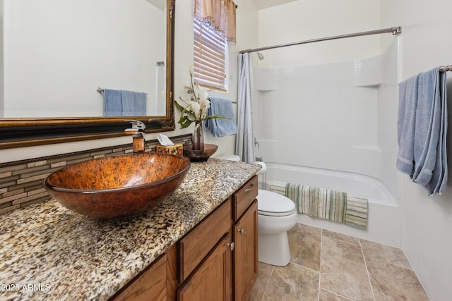 bathroom featuring vanity, toilet, and shower / tub combo