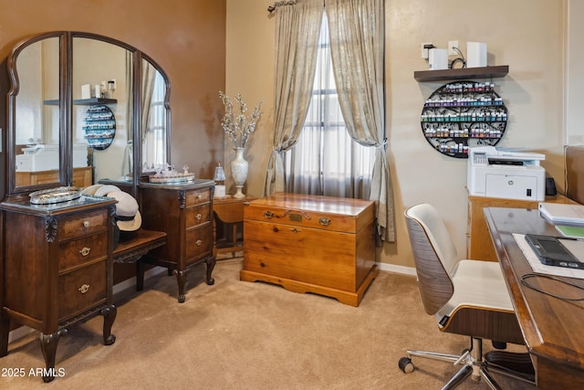 office area featuring baseboards and carpet