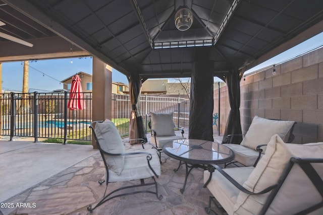 view of patio / terrace with outdoor dining space, a pool, and a fenced backyard