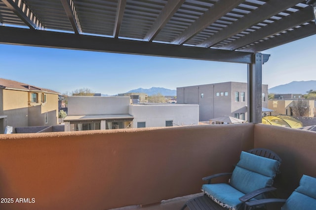 balcony with a pergola and a mountain view