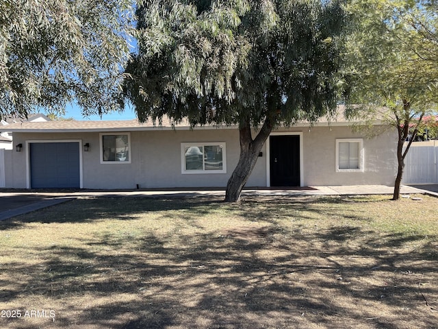 single story home with a garage