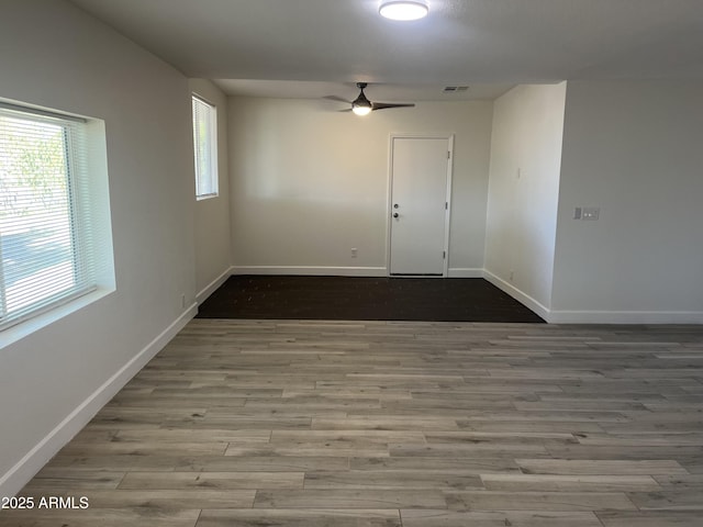 unfurnished room featuring ceiling fan and light hardwood / wood-style flooring