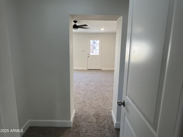 corridor with carpet flooring