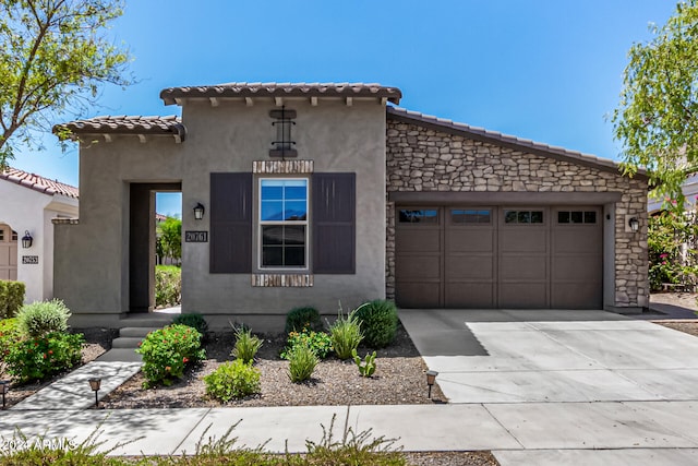 mediterranean / spanish house featuring a garage