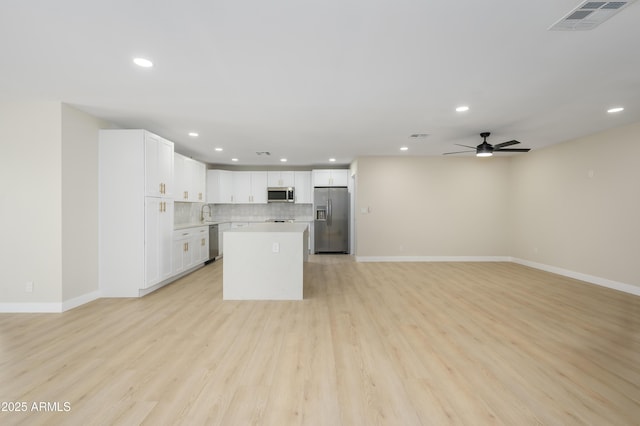 kitchen featuring visible vents, baseboards, recessed lighting, light countertops, and appliances with stainless steel finishes