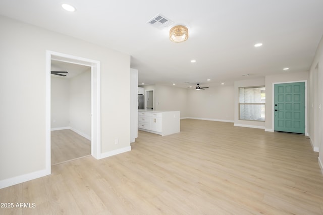 unfurnished living room with ceiling fan, recessed lighting, baseboards, light wood-type flooring, and visible vents