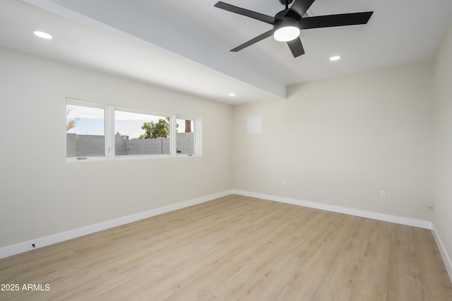 empty room featuring light wood-type flooring, a ceiling fan, and recessed lighting