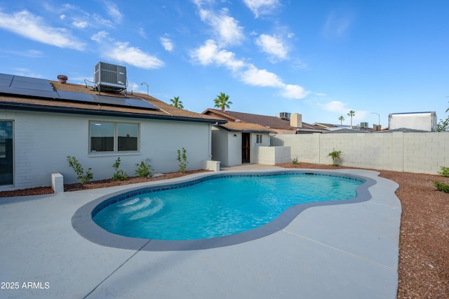 view of swimming pool with a fenced in pool, a fenced backyard, and central AC