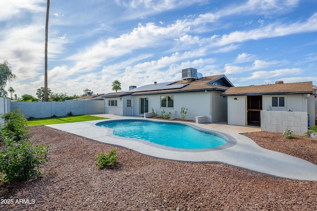 view of pool featuring a patio, a fenced in pool, central AC unit, and a fenced backyard