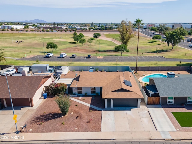 birds eye view of property featuring view of golf course and a residential view