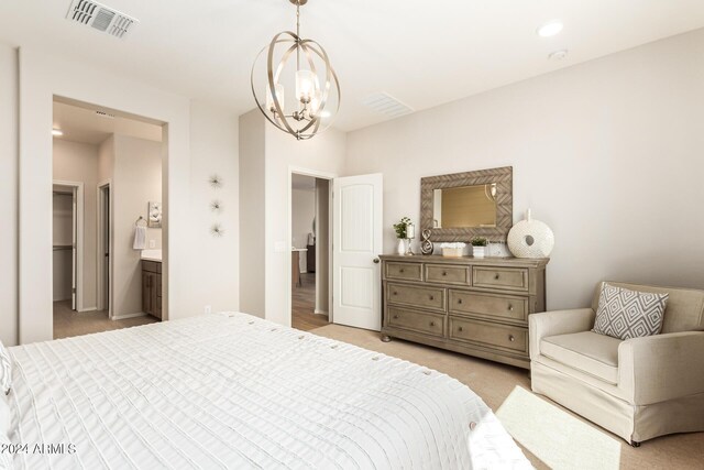 18197 W Cielo Grande Ave, Surprise, AZ 85387 - bedroom featuring ensuite bath, light colored carpet, and a notable chandelier