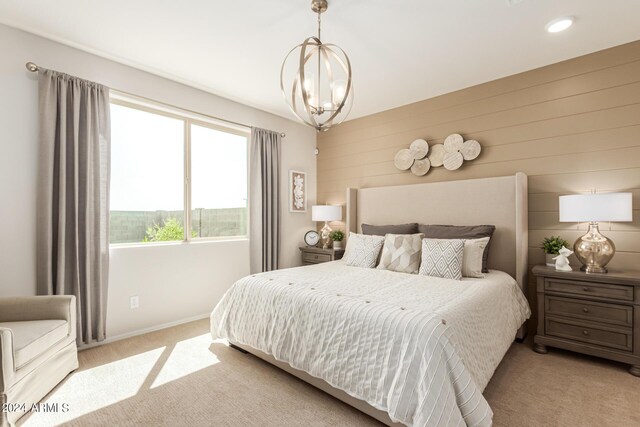 18197 W Cielo Grande Ave, Surprise, AZ 85387 - carpeted bedroom with wood walls and an inviting chandelier